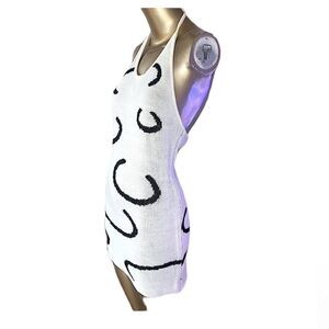 White & black knit halter dress. Backless mini